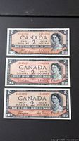Front views of three 1954 Canadian $2 notes