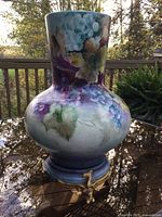 Front view of porcelain vase on footed base