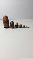 Full lineup of seven nested dolls from largest to smallest