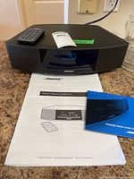 Wave Music System IV with remote and manuals visible