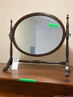 Front view of oval dressing mirror on stand
