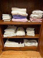 Overall view of shelves with towels and folded linens