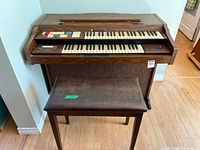 Front view of Hammond Stage 2 console organ with bench