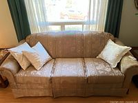 Full view of sofa with pillows