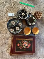 Group shot of all stoneware pieces and placemats on floor