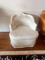 Front view of one upholstered tub chair