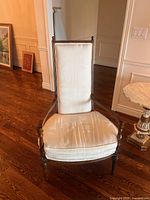 Front view showing full chair, upholstery, wood frame