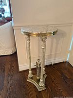 Full view of pedestal stand showing marble top, columns and base
