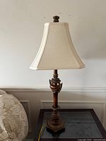 Full view of lamp with shade on side table