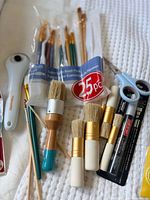 Overview of packaged brush set, loose stencil brushes, scissors, marker pack