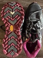 Top and outsole view showing Vibram Arctic Grip logo, tread condition, laces and interior