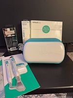 Cricut Joy machine with multiple boxed accessories visible