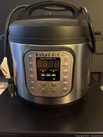 Front view of Instant Pot showing control panel and exterior condition