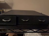 Front view of black three-drawer K-Cup holder