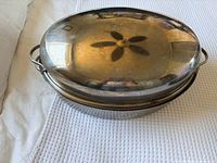 Roaster with domed lid in place showing overall form