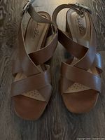 Top view of brown crisscross sandals