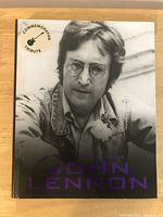 Front cover showing John Lennon portrait and tribute sticker