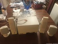 Entire speaker lot: subwoofer, two tall satellites, two small satellites