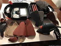 Entire kit: sander, storage tray, sanding sheets, polishing pads
