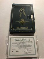front of collector box showing graphics and tear, COA in plastic below