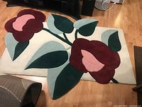 Full view of rug showing overall floral pattern and colors