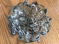 Top view of multicolor speckled ruffled glass bowl