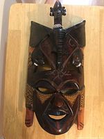 Full view of carved wooden tribal mask