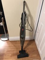 Full view of Hoover Flair stick vacuum standing upright