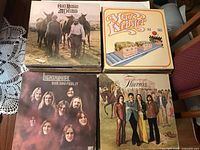 Stack of LPs showing Ozark Mountain Daredevils, Max Webster, Lighthouse, The Guess Who covers