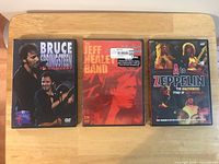 Front view of three DVD cases showing cover art