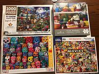 Group shot of all four puzzle boxes showing fronts and titles