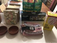 All lot items displayed: scarf, tumbler box, straws box, terracotta dishes, plaque box