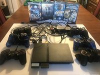Full lot: console, controllers, cables, games