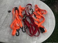 All three tie-down straps displayed on table