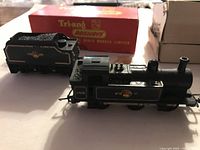 Locomotive No. 47606 with separate BR tender and Tri-ang box in background