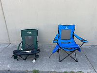 Green and blue foldable camping chairs side by side with carry bag