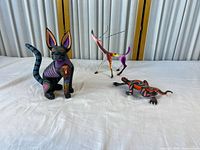 Group shot of three Oaxacan wood animal carvings