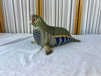 Full view of carved and painted elephant seal