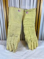 Front view of both long sleeve heat gloves showing overall design and wear