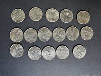 All 16 quarters laid out in three rows