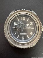 Front view of Invicta automatic watch showing dial and missing bezel insert