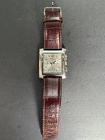 Full watch front view showing dial, case, and strap