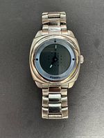 Front view of Fossil analog-digital wristwatch showing stainless steel bracelet and dial