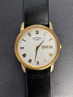 Front dial view showing Rotary name, Roman numerals, day-date window