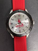 Front view showing dial, bezel, logo, strap