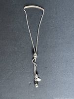 Full view of sterling silver adjustable bracelet on black background