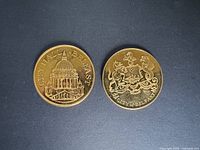 Front view of both medals showing Belfast City Hall and coat of arms sides