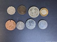 Group shot of all eight coins front side