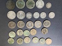 All 26 coins laid out in rows