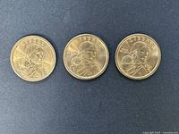 Three Sacagawea dollar coins obverse side